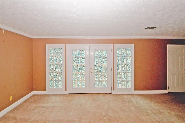 4161 Windermere Dr, Lithonia, GA 30038 - carpeted spare room with a textured ceiling, french doors, and ornamental molding