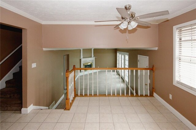 4161 Windermere Dr, Lithonia, GA 30038 - tiled spare room featuring stairs, crown molding, a fireplace, and baseboards
