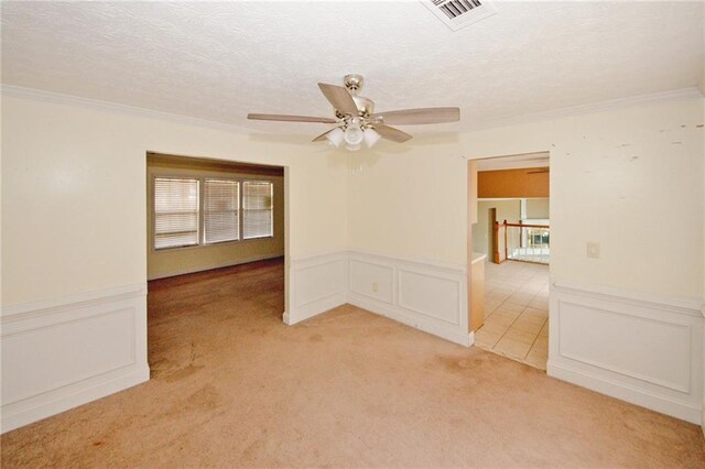 4161 Windermere Dr, Lithonia, GA 30038 - unfurnished room featuring visible vents, light colored carpet, ornamental molding, a decorative wall, and a textured ceiling