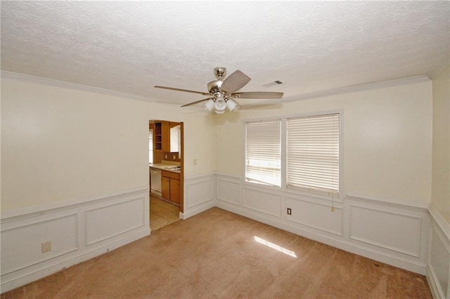 4161 Windermere Dr, Lithonia, GA 30038 - empty room featuring a wainscoted wall, light colored carpet, a ceiling fan, and a textured ceiling