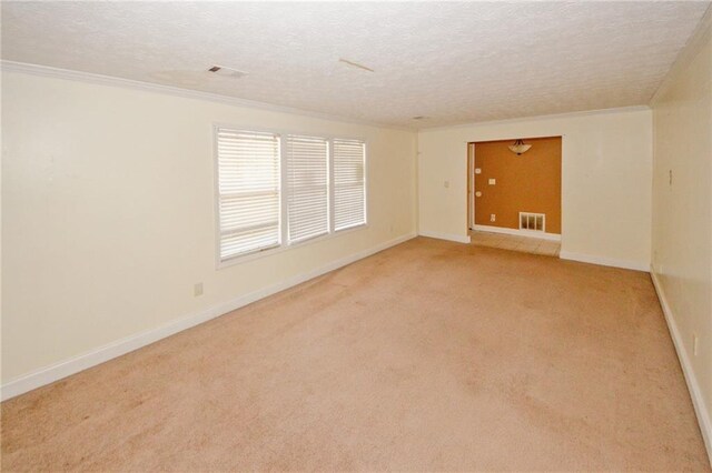 4161 Windermere Dr, Lithonia, GA 30038 - carpeted empty room with visible vents, baseboards, a textured ceiling, and crown molding