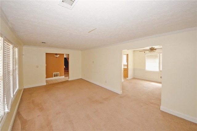 4161 Windermere Dr, Lithonia, GA 30038 - spare room featuring visible vents, light colored carpet, crown molding, and a textured ceiling