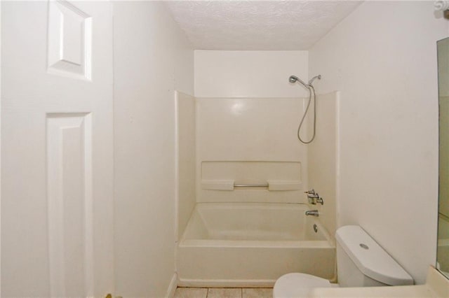 4161 Windermere Dr, Lithonia, GA 30038 - full bathroom with tile patterned flooring,  shower combination, toilet, and a textured ceiling