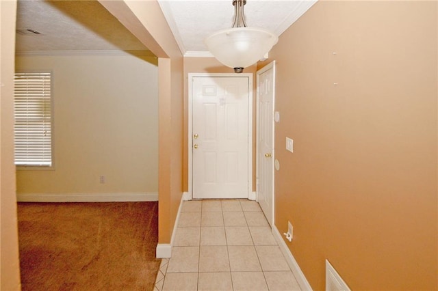 4161 Windermere Dr, Lithonia, GA 30038 - hallway featuring light tile patterned floors, baseboards, a textured ceiling, and crown molding