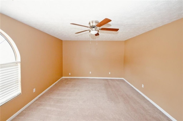 4161 Windermere Dr, Lithonia, GA 30038 - empty room with light carpet, a ceiling fan, baseboards, and a textured ceiling