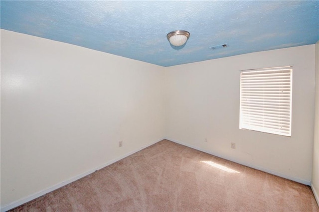 4161 Windermere Dr, Lithonia, GA 30038 - spare room with visible vents, baseboards, light colored carpet, and a textured ceiling