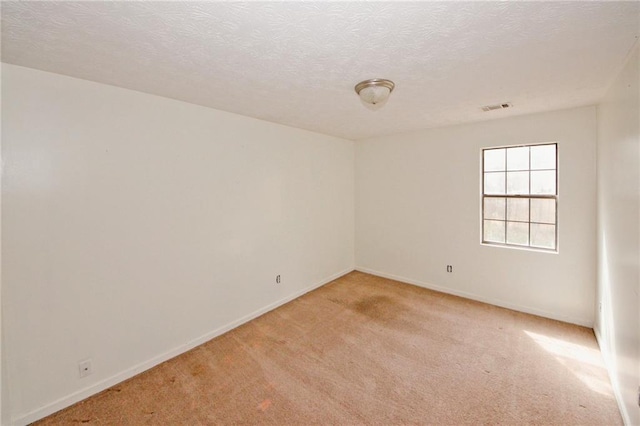 4161 Windermere Dr, Lithonia, GA 30038 - spare room featuring visible vents, baseboards, light colored carpet, and a textured ceiling