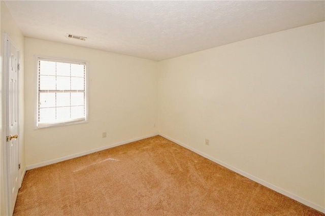 4161 Windermere Dr, Lithonia, GA 30038 - unfurnished room with visible vents, light carpet, a textured ceiling, and baseboards