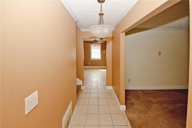 4161 Windermere Dr, Lithonia, GA 30038 - corridor with visible vents, baseboards, light tile patterned flooring, a textured ceiling, and crown molding