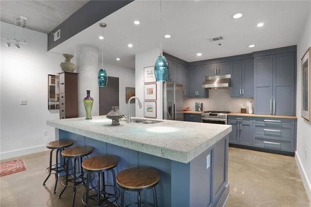 845 Spring St NW Unit 129, Atlanta, GA 30308 - kitchen featuring finished concrete floors, under cabinet range hood, appliances with stainless steel finishes, a sink, and baseboards