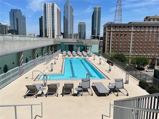 845 Spring St NW Unit 129, Atlanta, GA 30308 - community pool with a view of skyline and a patio