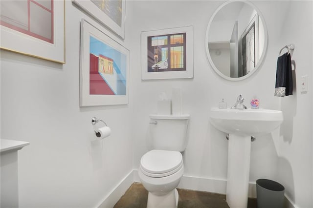 845 Spring St NW Unit 129, Atlanta, GA 30308 - bathroom featuring baseboards and toilet