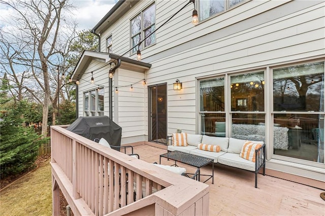 deck featuring an outdoor hangout area and grilling area