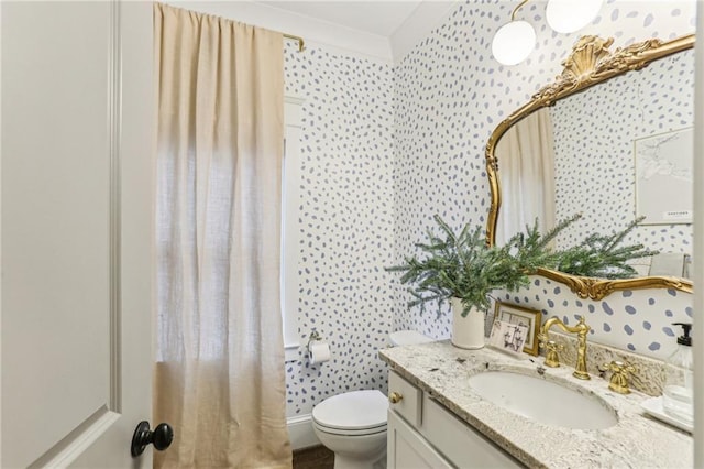 bathroom featuring vanity and toilet