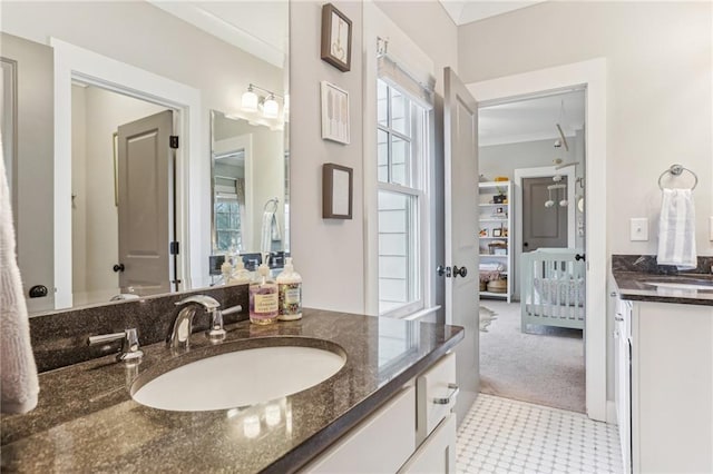 bathroom featuring vanity and crown molding