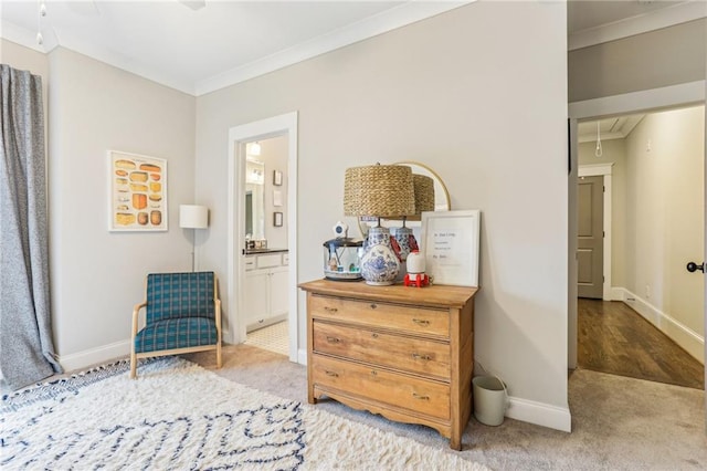 living area featuring crown molding and light carpet