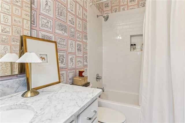 full bathroom with vanity, shower / tub combo with curtain, and toilet