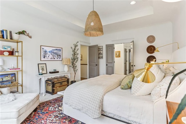 bedroom featuring a raised ceiling