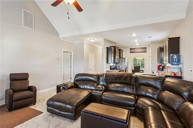 living room with ceiling fan, high vaulted ceiling, and sink