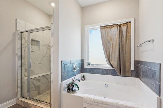 bathroom featuring plus walk in shower