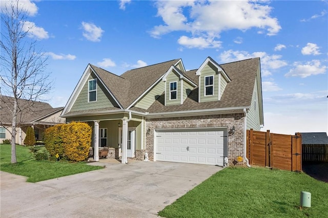 view of front of property with a garage and a front lawn