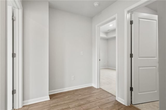 corridor featuring light hardwood / wood-style floors