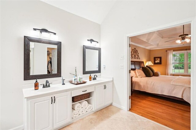 bathroom featuring tile patterned floors, a sink, a ceiling fan, crown molding, and connected bathroom