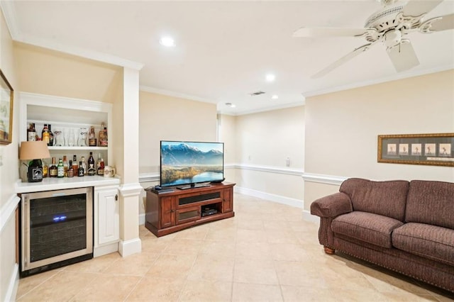 living area with crown molding, beverage cooler, visible vents, and a bar