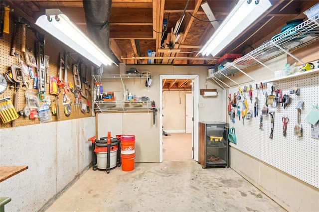 unfinished below grade area featuring a workshop area