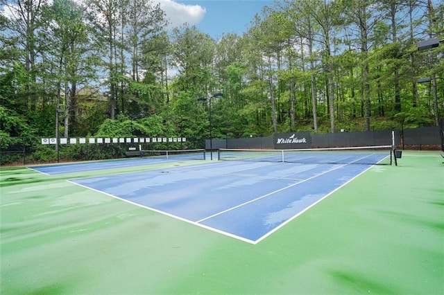 view of sport court featuring community basketball court and fence