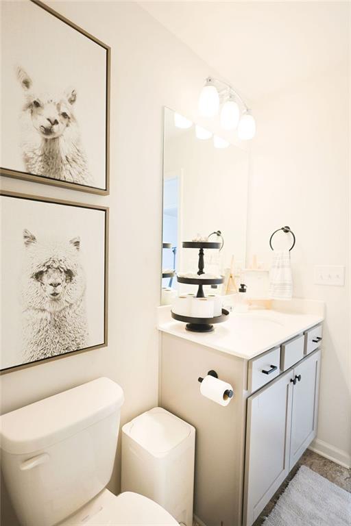 382 Winston Cir, Canton, GA 30114 - half bathroom featuring toilet and vanity