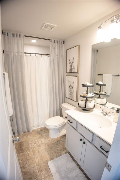 382 Winston Cir, Canton, GA 30114 - bathroom with vanity, toilet, and a shower with curtain