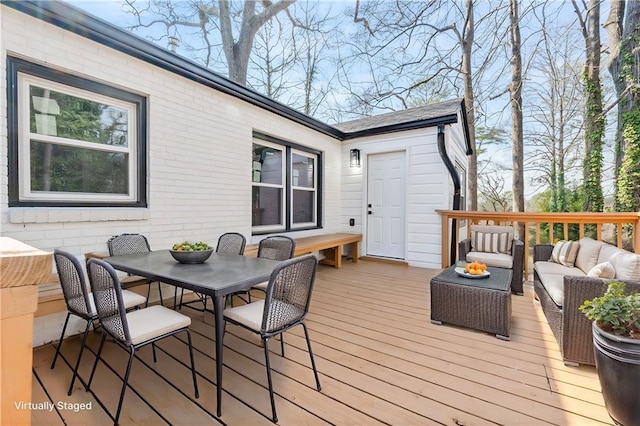 wooden deck featuring an outdoor living space and outdoor dining space