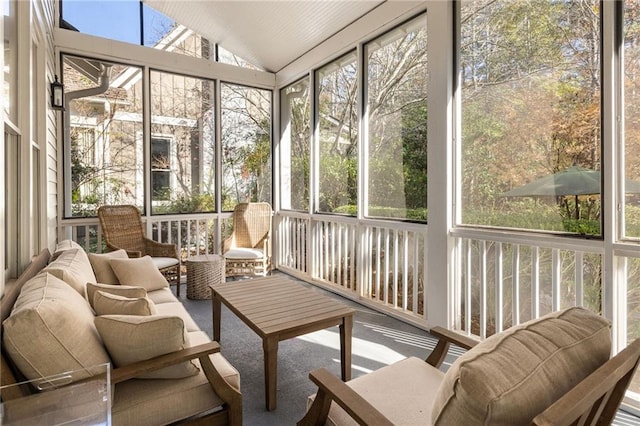 sunroom featuring a healthy amount of sunlight and lofted ceiling