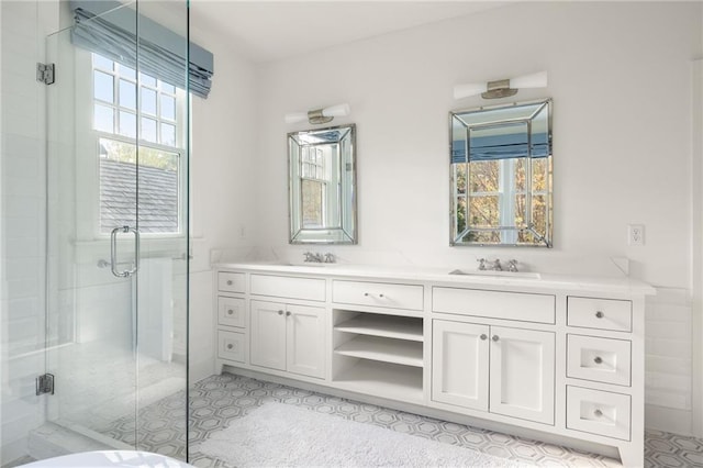 bathroom featuring tile patterned floors, vanity, and an enclosed shower