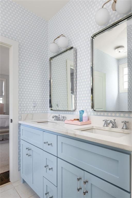 bathroom with tile patterned flooring and vanity