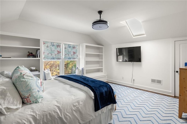 bedroom featuring vaulted ceiling