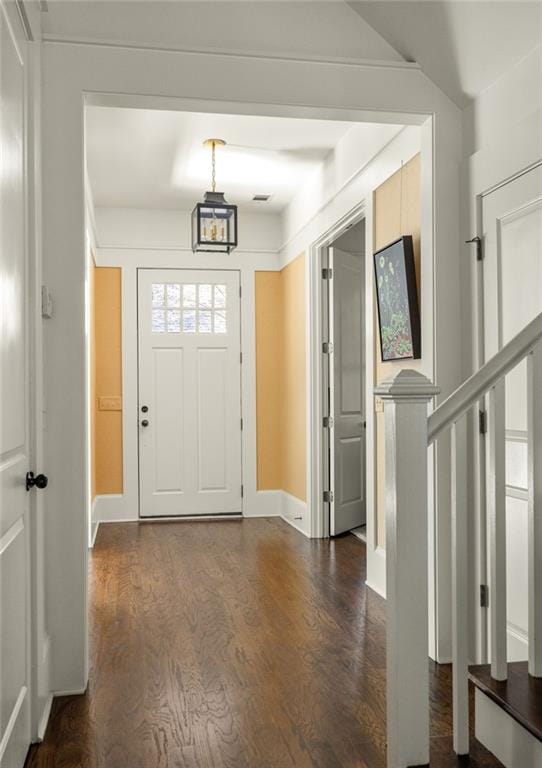 entrance foyer featuring dark hardwood / wood-style floors