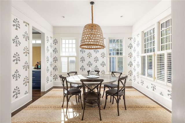 dining space with dark hardwood / wood-style floors