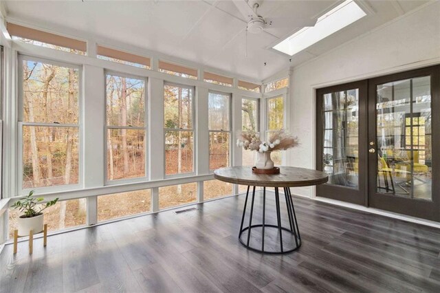 unfurnished dining area with french doors, dark hardwood / wood-style floors, an inviting chandelier, and crown molding