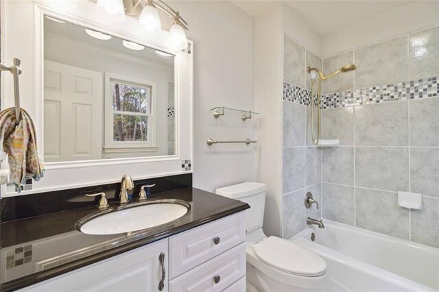 bathroom with plus walk in shower, vanity, crown molding, and tile patterned flooring