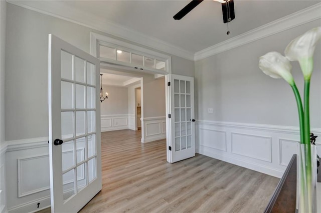 6867 Kate Ln, Flowery Branch, GA 30542 - unfurnished room with french doors, a decorative wall, ornamental molding, ceiling fan, and a wainscoted wall