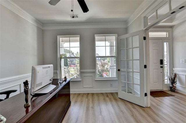6867 Kate Ln, Flowery Branch, GA 30542 - office featuring light wood finished floors, a ceiling fan, a decorative wall, wainscoting, and crown molding