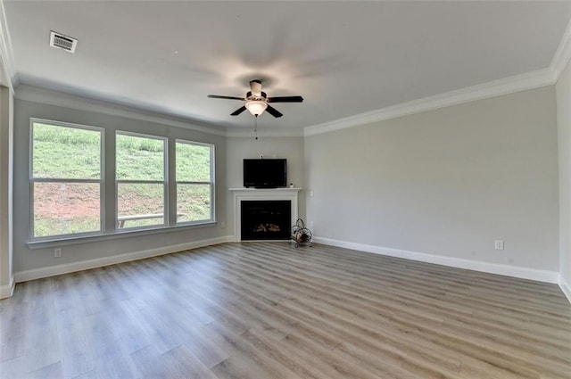 6867 Kate Ln, Flowery Branch, GA 30542 - unfurnished living room with a ceiling fan, ornamental molding, light wood-type flooring, and a fireplace