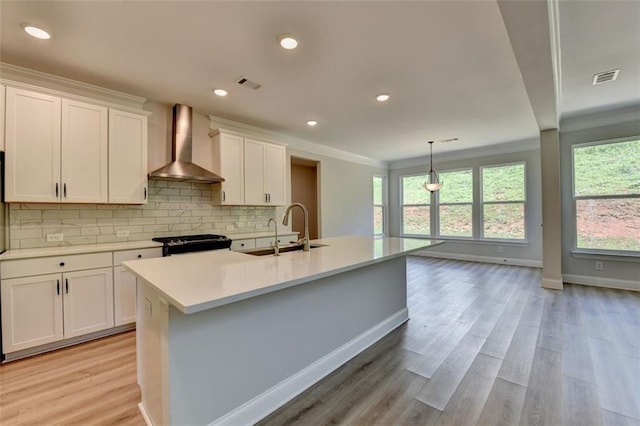 6867 Kate Ln, Flowery Branch, GA 30542 - kitchen with wall chimney range hood, range, plenty of natural light, light countertops, and crown molding