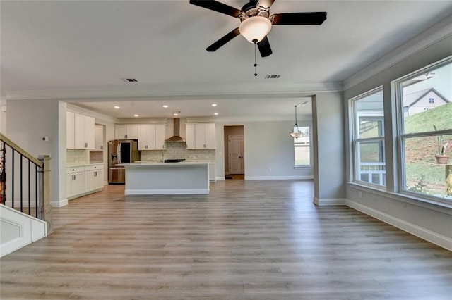 6867 Kate Ln, Flowery Branch, GA 30542 - unfurnished living room featuring crown molding, light wood-style floors, stairway, ceiling fan, and recessed lighting