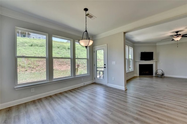 6867 Kate Ln, Flowery Branch, GA 30542 - unfurnished living room with wood finished floors, crown molding, a fireplace, and ceiling fan