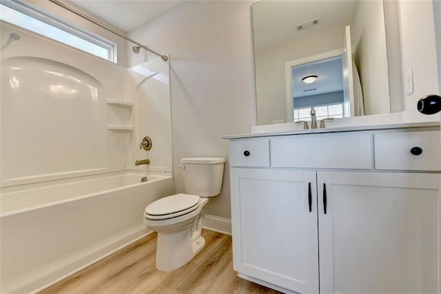 6867 Kate Ln, Flowery Branch, GA 30542 - bathroom featuring shower / bath combination, wood finished floors, and vanity