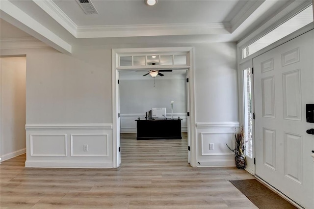 6867 Kate Ln, Flowery Branch, GA 30542 - entrance foyer featuring a decorative wall, light wood-style floors, crown molding, wainscoting, and ceiling fan