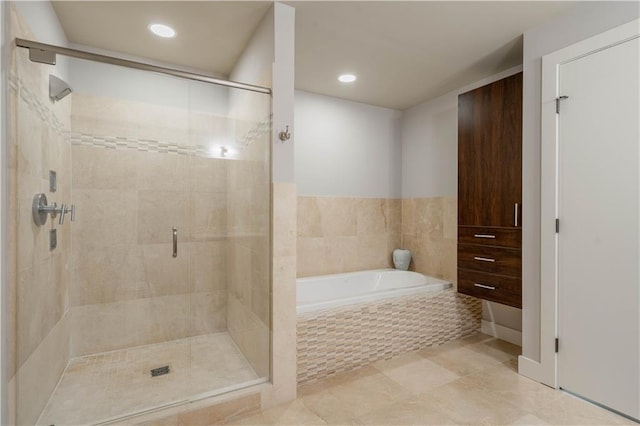 20 10th St NW Unit 704, Atlanta, GA 30309 - bathroom with a garden tub, a shower stall, tile patterned floors, and recessed lighting
